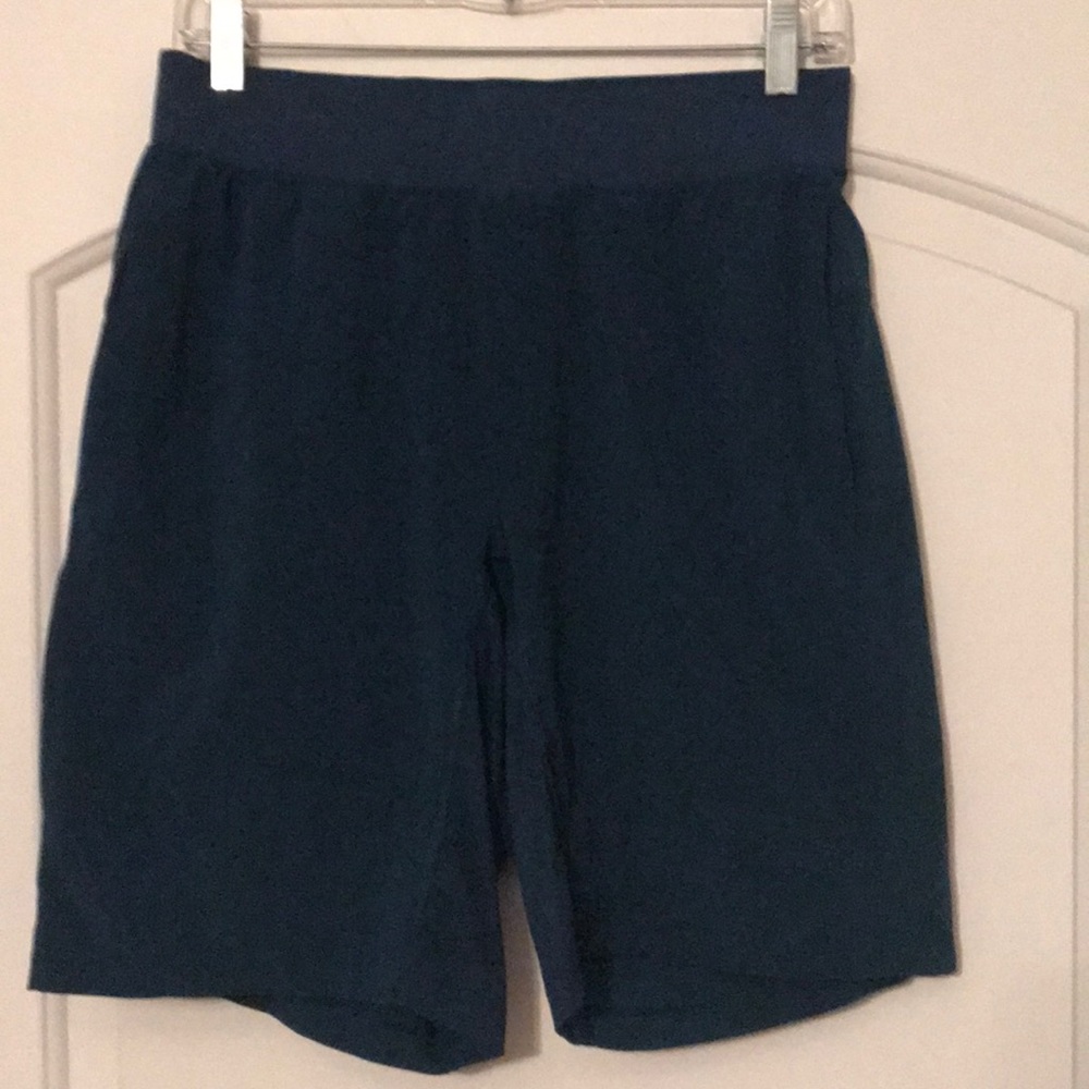 Men’s Lululemon dark turquoise green shorts size M